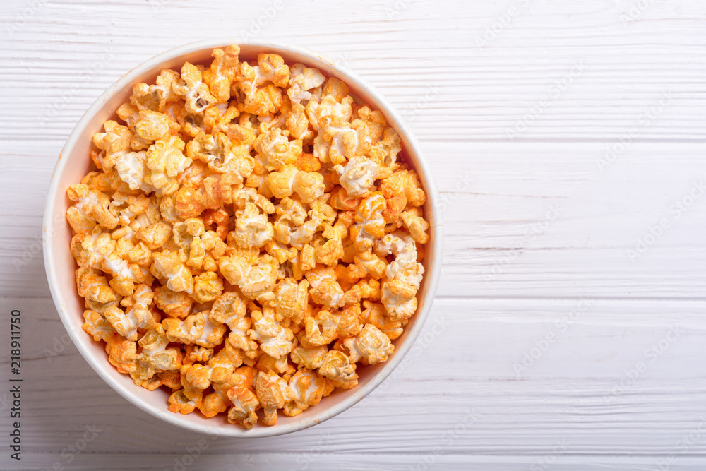 Yellow cheese popcorn in bowl Yellow cheese popcorn in bowl
