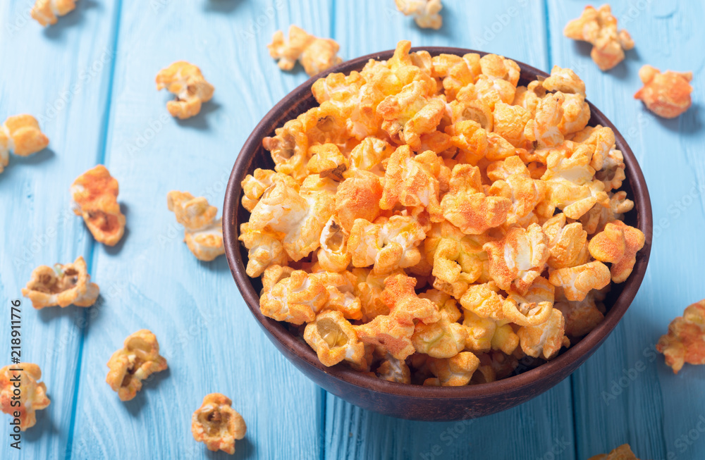 Yellow cheese popcorn in bowl Yellow cheese popcorn in bowl
