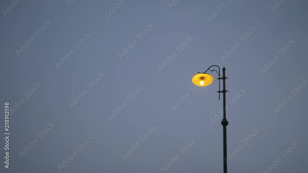 A street city light lamp against sky background at sunset. Copyspace text A street city light lamp against sky background at sunset. Copyspace text