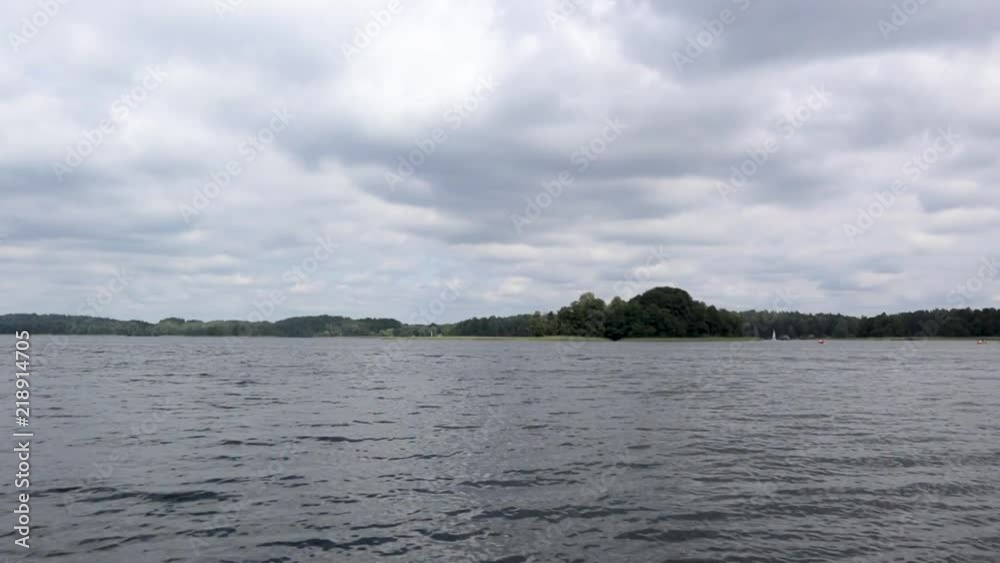 Flying low over the calm river. Beautiful sky, calm water. Trees reflected in the water. Aerial shooting. Flying low over the calm river. Beautiful sky, calm water. Trees reflected in the water. Aerial shooting.