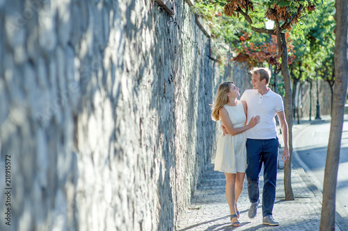 Young romantic couple walking along a small street in Sorrento, Italy