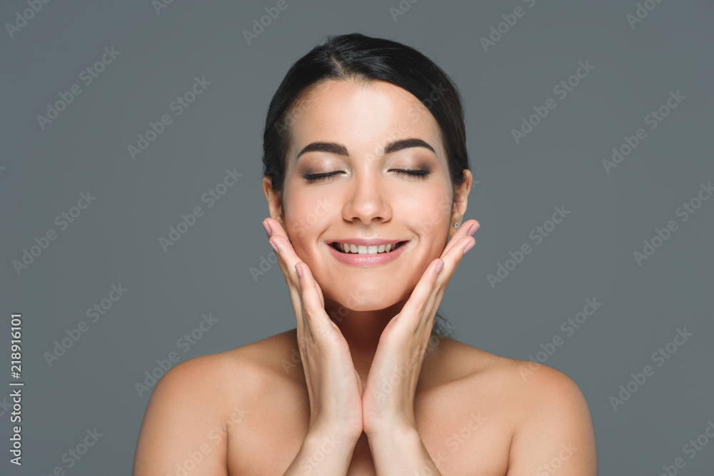portrait of beautiful smiling woman with white teeth and eyes closed isolated on grey portrait of beautiful smiling woman with white teeth and eyes closed isolated on grey