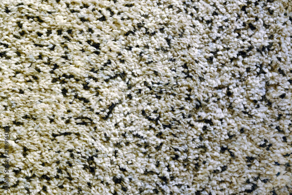 A woven Mat of reeds or straw-yellow in color. The texture of dry cane. Light yellow.