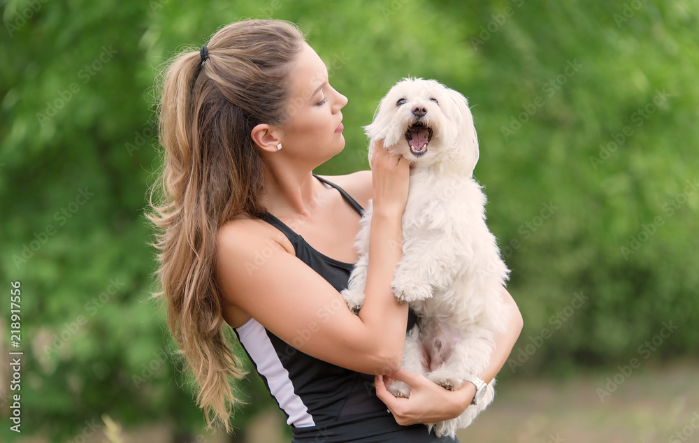 Bichon bolognese dog with beautiful in the park Bichon bolognese dog with beautiful in the park