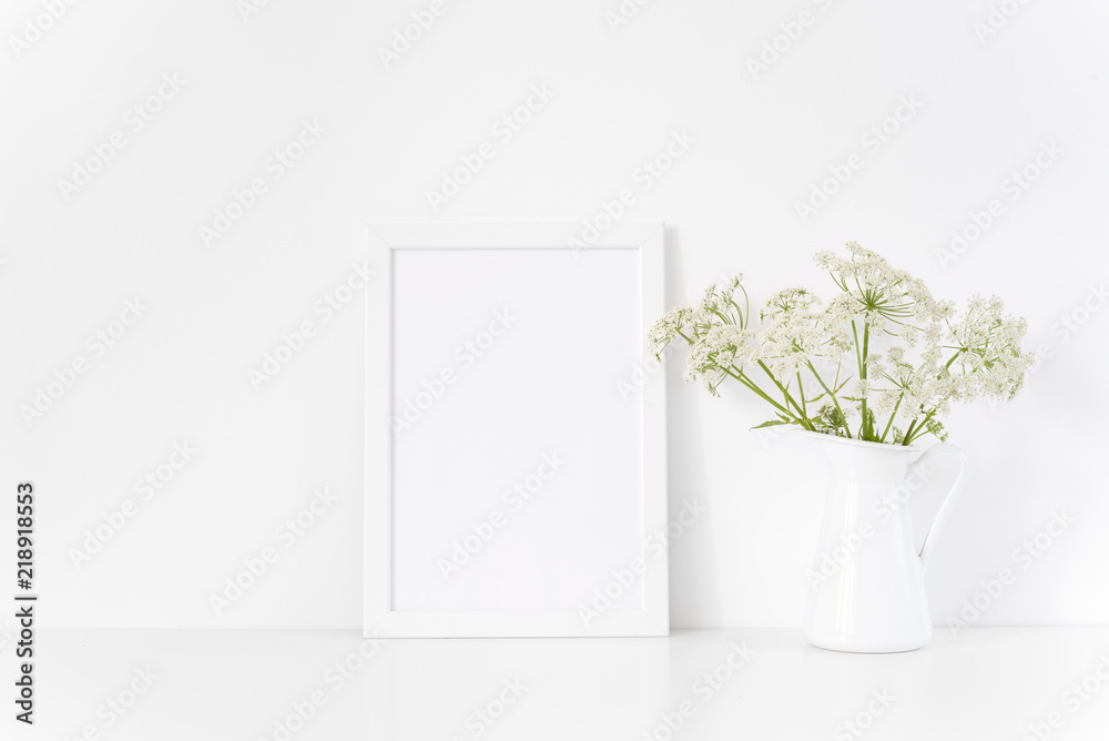 White frame mock up with Aegopodium in jug. poster Mockup for headline, design.Template for small businesses,lifestyle bloggers