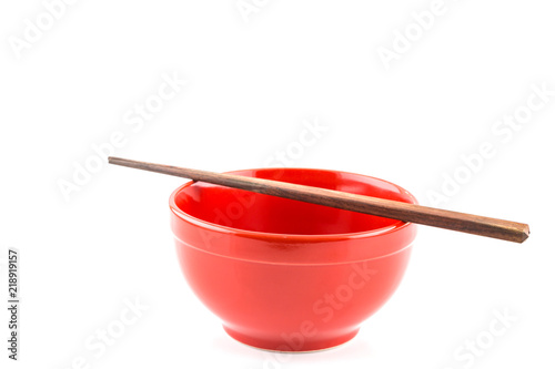 Fresh red bowl with chopsticks isolated on white