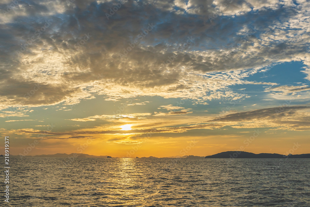 Fototapeta premium Sunset at beach sea sky clouds twilight time