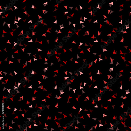 Elegant black seamless pattern with chaotic sparks in different shades of red and pink