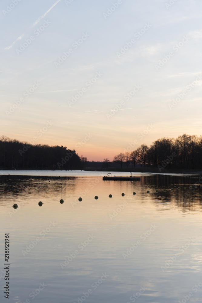 Fototapeta premium Dusk Over A Large Lake In Summer