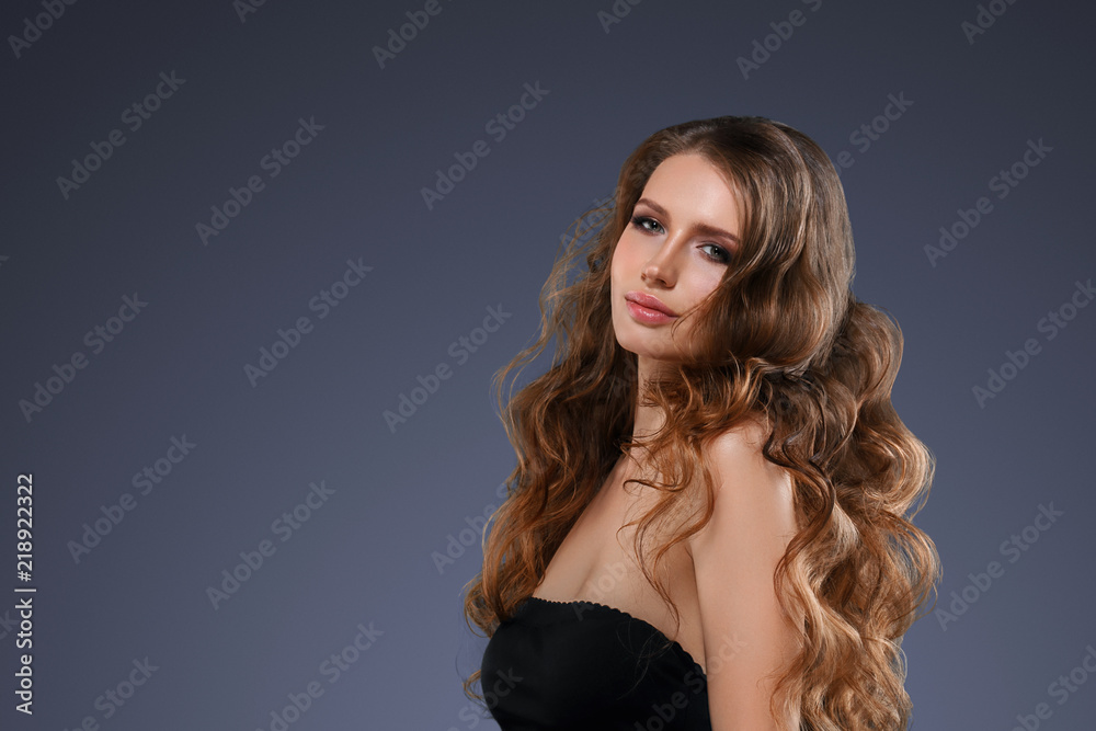 Beautiful hair long curly hairstyle woman with beauty makeup female model portrait Beautiful hair long curly hairstyle woman with beauty makeup female model portrait