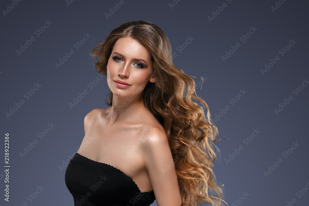 Beautiful hair long curly hairstyle woman with beauty makeup female model portrait Beautiful hair long curly hairstyle woman with beauty makeup female model portrait