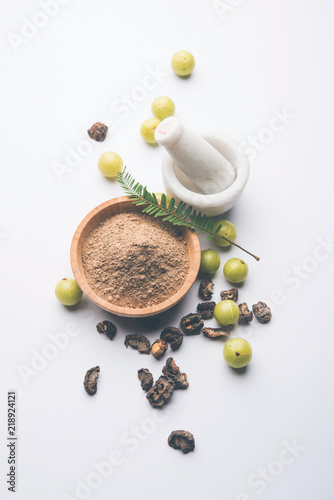 Amla powder with raw Avla, it's an Ayurvedic alternative medicine photo