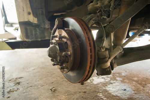Repairing disc brake of the mini-truck in the garage