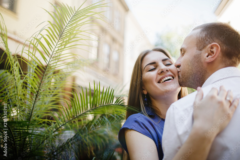 Fototapeta premium Beautiful happy couple embracing in the city.