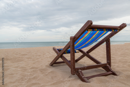 Beach chair on the sand with sea and sky