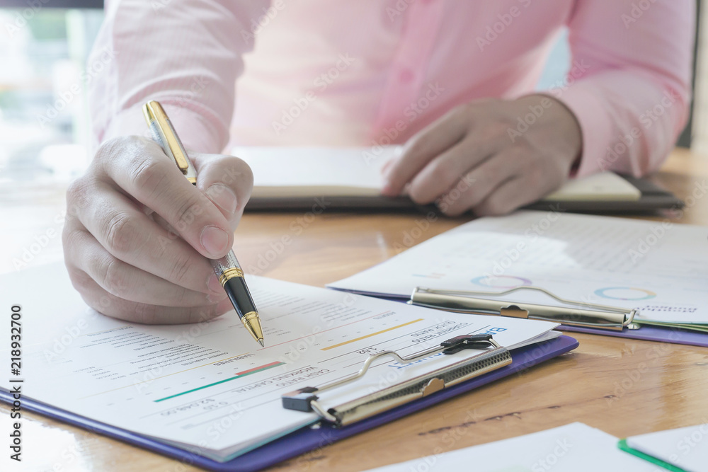Administrator business man financial inspector and secretary making report, calculating or checking balance. - Business Concept Administrator business man financial inspector and secretary making report, calculating or checking balance. - Business Concept