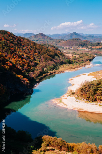 Seogang river in Seonam village with autumn forest. Gangwon, South Korea photo