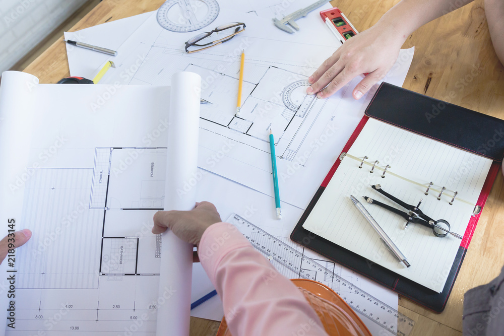Team of engineers working together in a architect office.- Architectural Concept Team of engineers working together in a architect office.- Architectural Concept