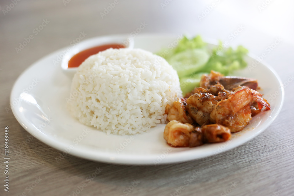 Stir fried shrimps with garlic and cooked rice. Stir fried shrimps with garlic and cooked rice.