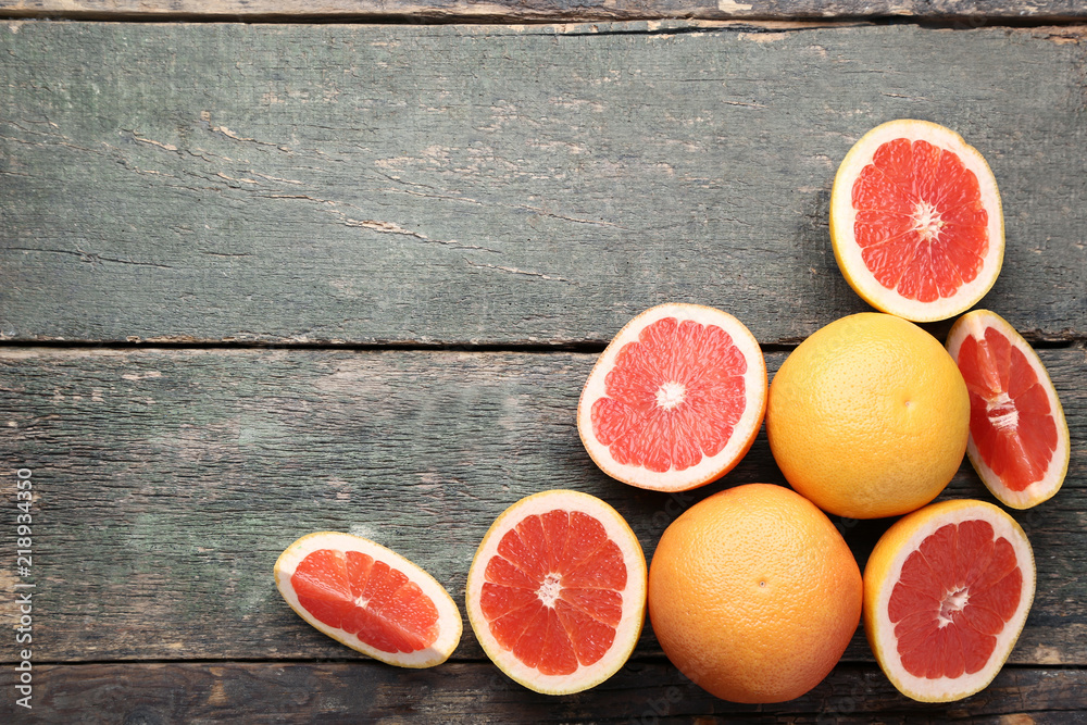 Ripe grapefruits on grey wooden table Ripe grapefruits on grey wooden table