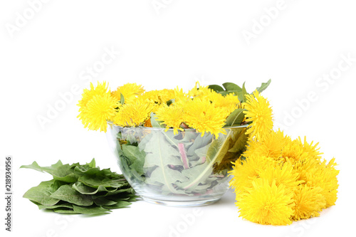 Fototapeta Naklejka Na Ścianę i Meble -  Yellow dandelions in bowl isolated on white background