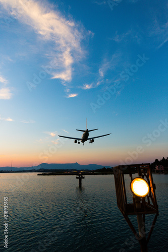 Aeroplane landing during sunset