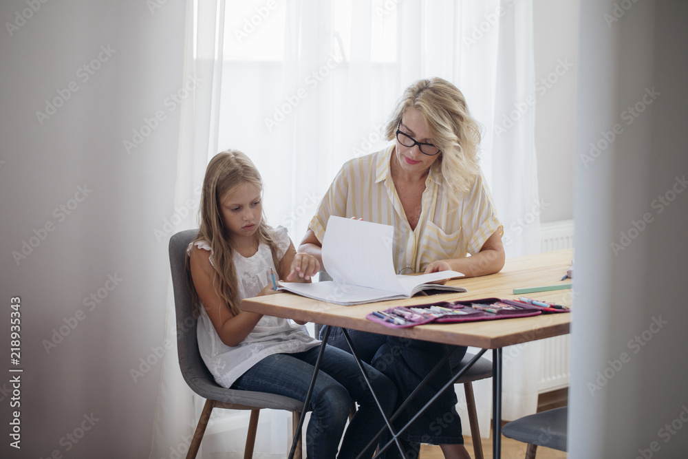 Mother Studying with Her Child Mother Studying with Her Child