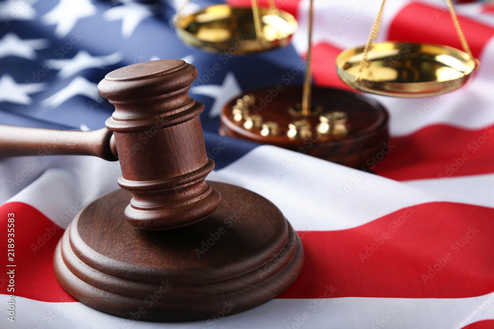 Judge gavel with scales and american flag