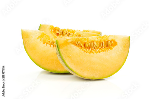 Group of three slices of fresh melon cantaloupe variety isolated on white background