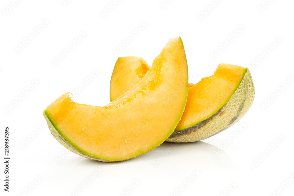 Group of two slices of fresh melon cantaloupe variety without seeds isolated on white background