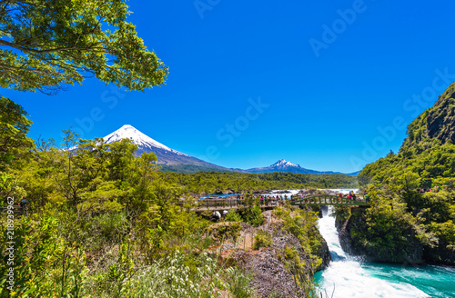 PUERTO VARAS, CHILE - JANUARY 10, 2018: .. Salutos de Petrohue waterfalls and volcano Osorno. Copy space for text. photo