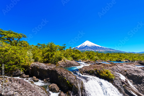 Salutos de Petrohue waterfalls and volcano Osorno, Puerto Varas, Chile. Copy space for text.