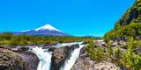 PUERTO VARAS, CHILE - JANUARY 10, 2018: Salutos de Petrohue waterfalls and volcano Osorno. Copy space for text.