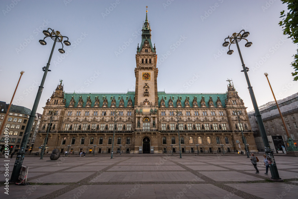 Hamburg City Hall is the seat of local government of the Free and Hanseatic City of Hamburg, Germany. Sunset.