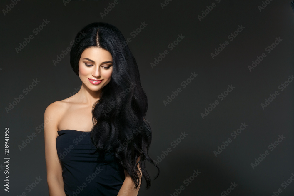 Fototapeta premium Black hair woman. Beautiful brunette hairstyle fashion portrait over dark background