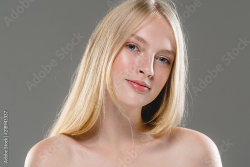 Closeup woman face with healthy skin beauty eyes and lips blonde beautiful girl