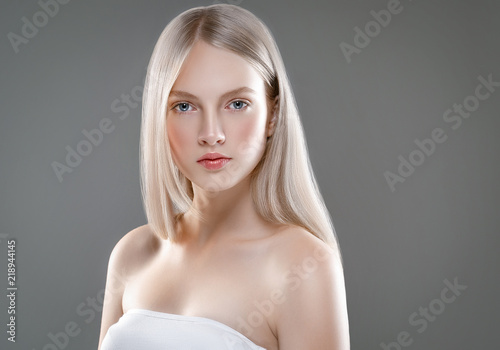Murais de parede Beautiful Woman Face Portrait Beauty Skin Care Concept with long blonde hair  ov