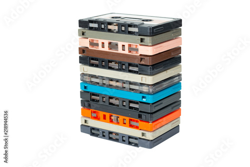 Cassette tapes stack ,side view. Obsolete technology of audio recording and playback format audio cassette tape isolated on white background with clipping path.