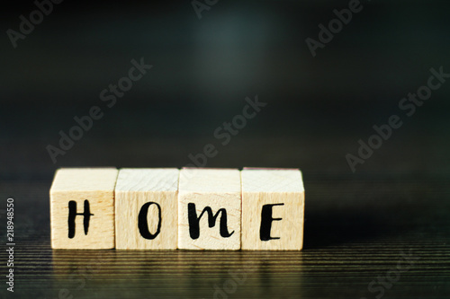 HOME - word build from wooden cubes, selective focus, free copy space