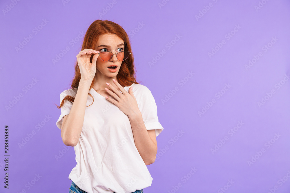 Portrait of an amazed young girl in sunglasses Portrait of an amazed young girl in sunglasses