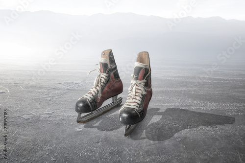 Vintage ice skates on a ice photo