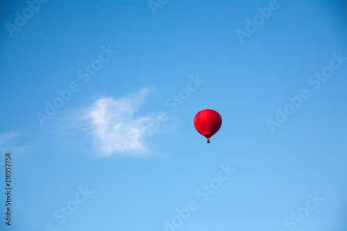 Red ballon against the beautiful blue sky at the festival in Kamyanets Podolsky, Ukraine photo