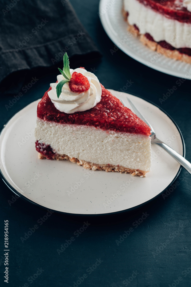 Raspberry tart, mousse cake, cheesecake with fresh raspberries. Piece of cheesecake on a white plate. Raspberry tart, mousse cake, cheesecake with fresh raspberries. Piece of cheesecake on a white plate.