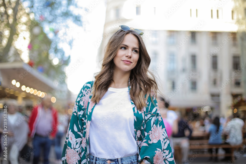 Fototapeta premium Girl walking in the city smiling