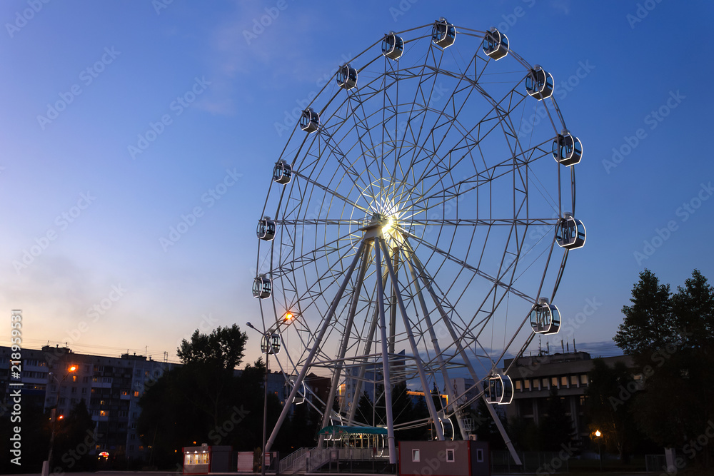 Ferris wheel in the evening in the park