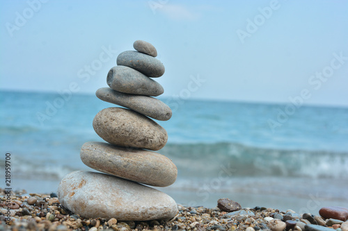 Relaxing on the beach  stack of stones.
