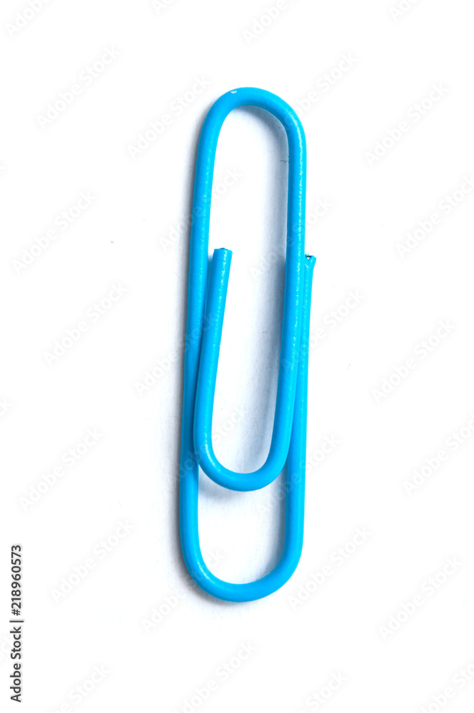 closeup of blue paperclip on white background closeup of blue paperclip on white background