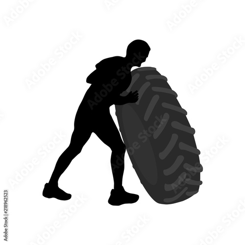 Black silhouette of athletic men carring big heavy tyre