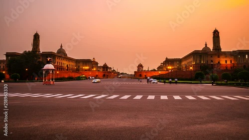 Delhi, India. Illuminated Rashtrapati Bhavan an Parliament building in Delhi, India. Time-lapse of car traffic trail lights. Dark sunset sky