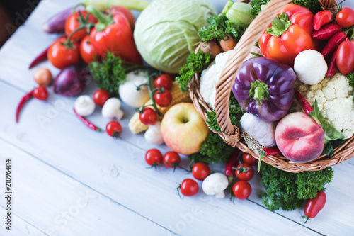 Fresh vegetables on a wooden background.